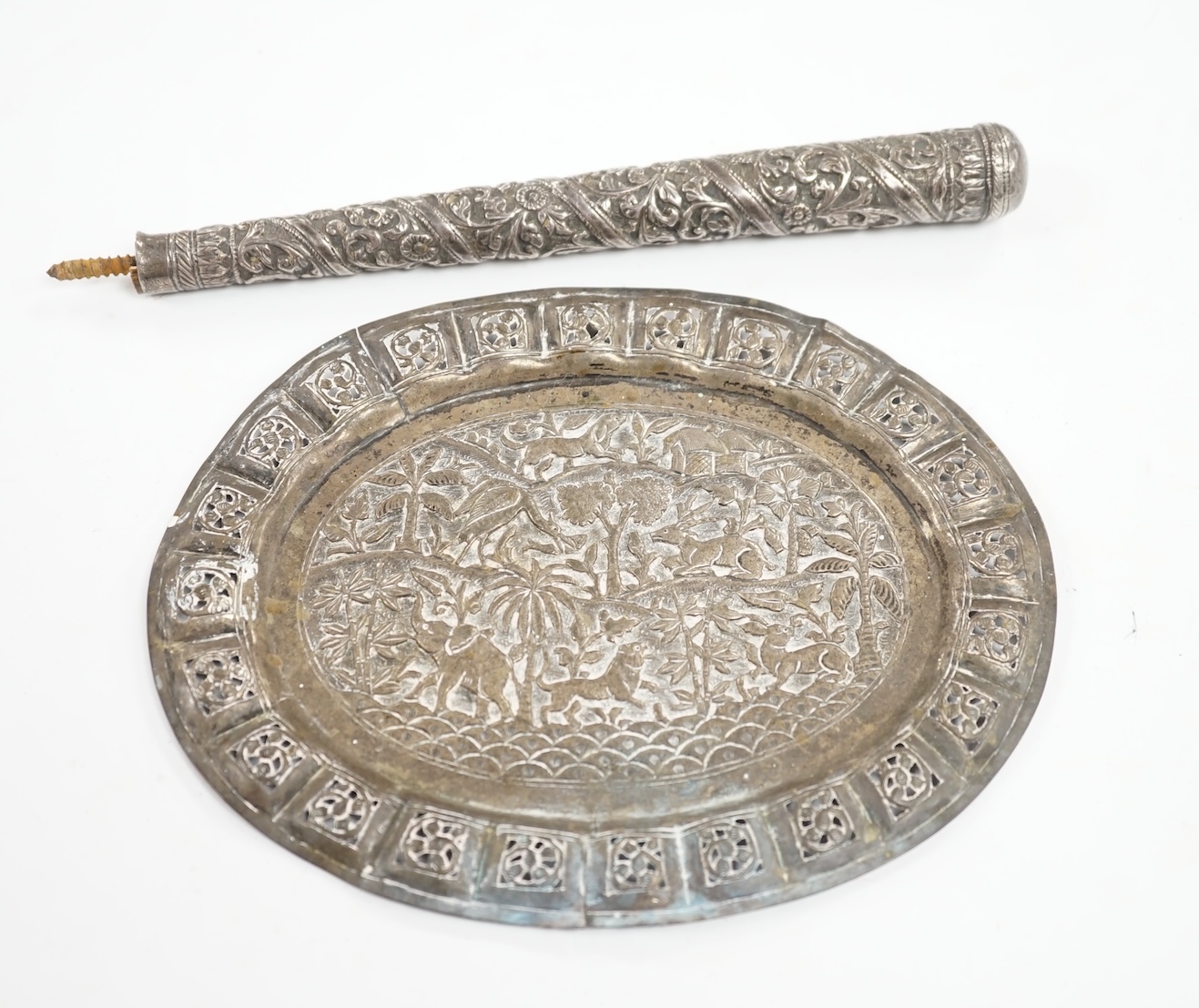 An Indian pierced white metal oval plaque and a white metal cane handle. Condition - poor to fair